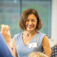 An Alumni smiling at the Alumni Leadership Summit.
